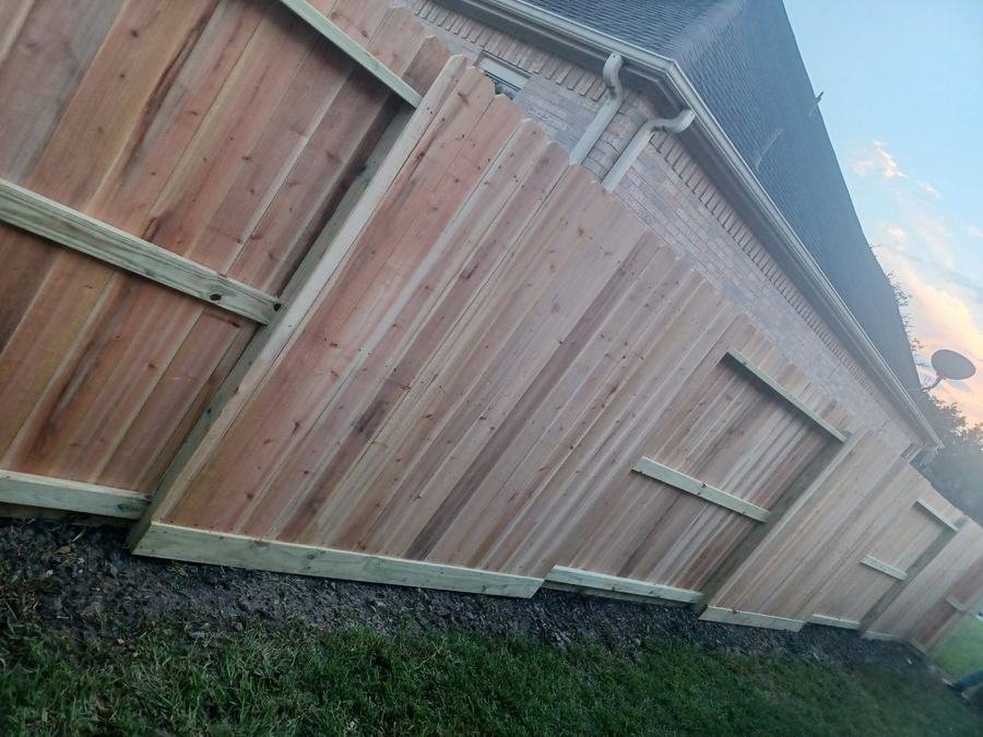 A newly installed wood privacy fence